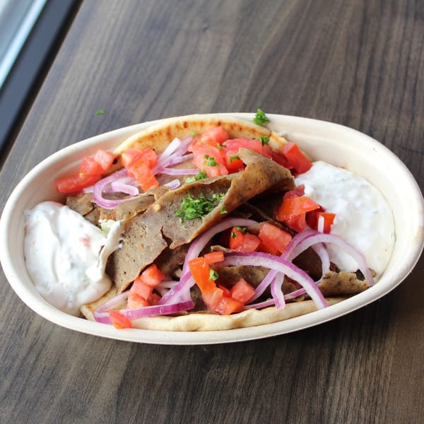 Baba Dari Mediterranean Grill's gyro with meat, tomatoes, red onions, and tzatziki sauce.